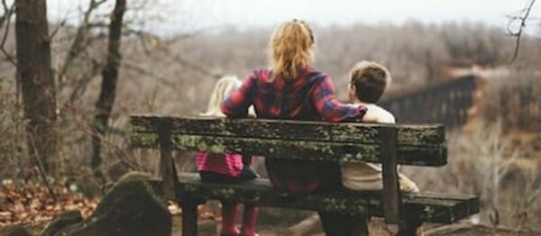 mom with kids on bench