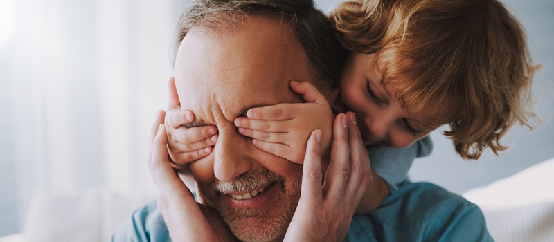 grandpa and grandchild playing together
