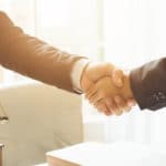 lawyer shaking hands with client