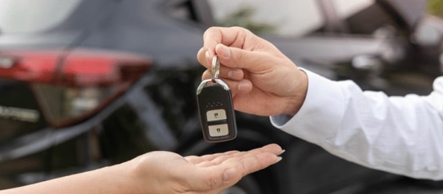 Wife handing over the keys to her ex.