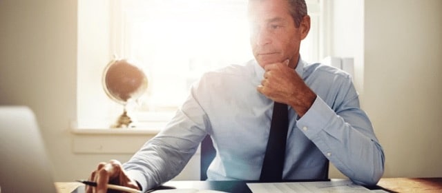 Man at computer contemplating divorce