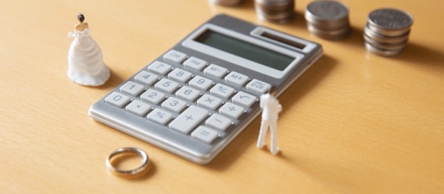 Calculator on lawyer's desk used during meeting about spousal maintenance in Texas