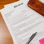 How to Secretly Prepare for a Divorce in Texas Person reviewing divorce paperwork in Texas