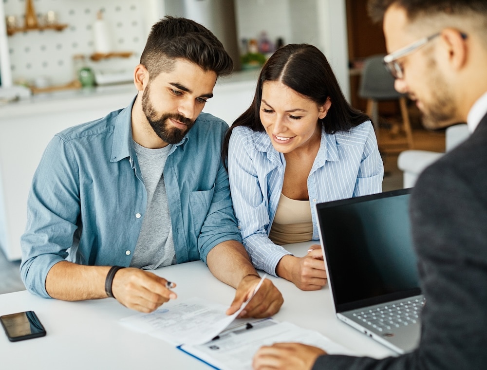 Couple reviewing a prenuptial agreement in Texas with an attorney
