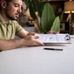 iStock-2212132943 Edited Person reviewing divorce timeline paperwork in Texas